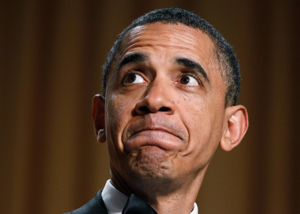 FILE - President Barack Obama makes a face as they show his video during his speech at the White House Correspondents' Association Dinner in Washington, April 30, 2011. (AP Photo/Manuel Balce Ceneta, File)