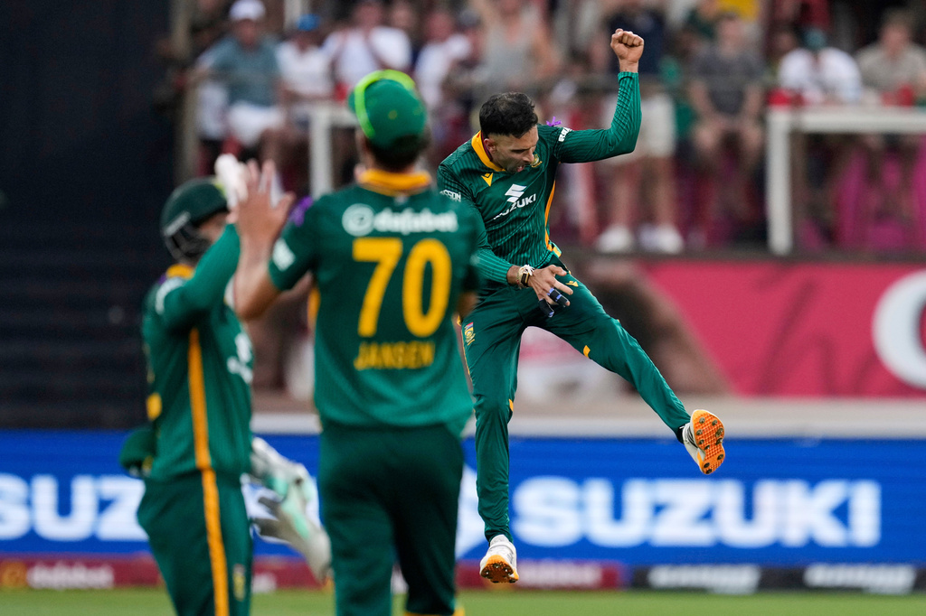 South Africa's bowler Keshav Maharaj, right, celebrates after dismissing Australia's batsman Jack Edwards during the first one day international cricket match between South Africa and Australia, in Durban, South Africa, Thursday, Sept. 24, 2026. (AP Photo/Themba Hadebe)