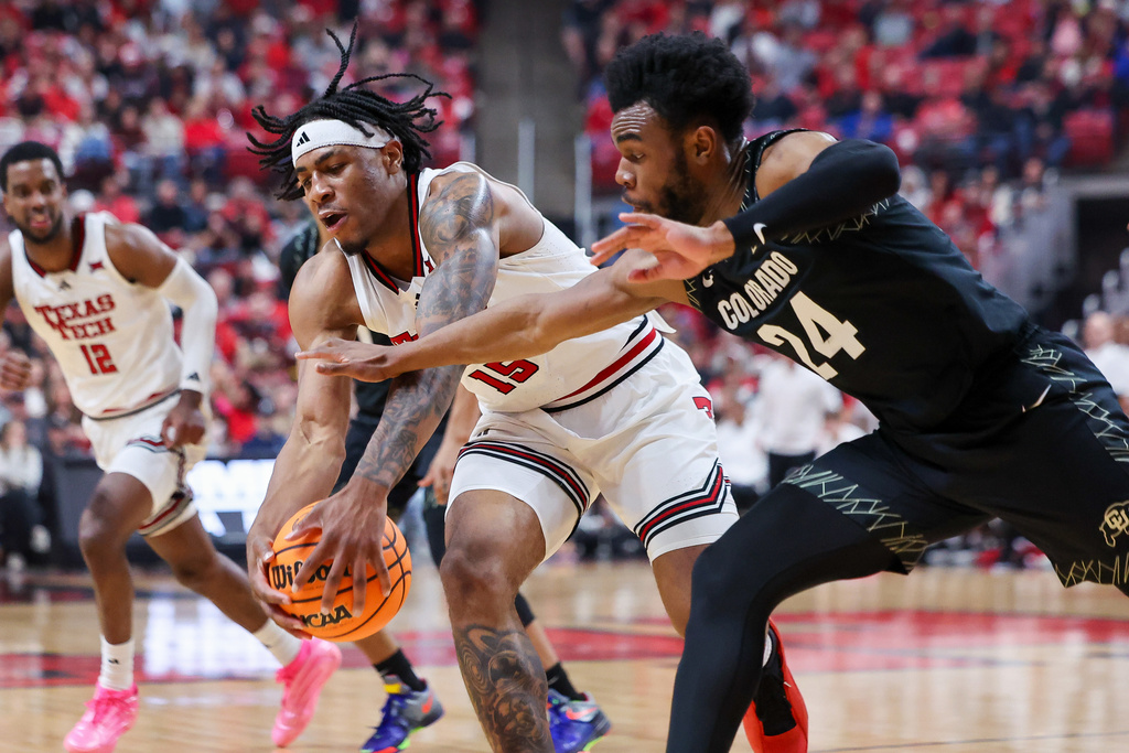 Texas Tech forward JT Toppin (15) gets a loose ball during the first half of an NCAA college basketball game against Colorado, Wednesday, Feb. 11, 2026, in Lubbock, Texas. (AP Photo/Chase Seabolt)