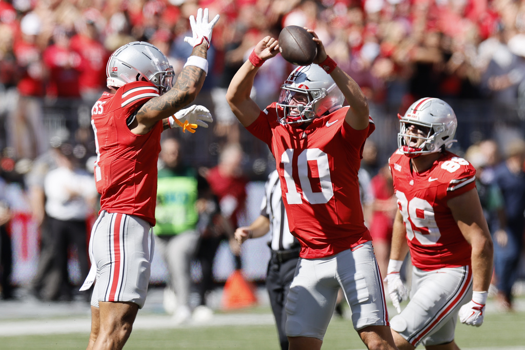 Ohio State receiver Brandon Inniss, left and quarterback Julian Sayin celebrate their win over Texas following an NCAA college football game, Saturday, Aug. 30, 2025, in Columbus, Ohio. (AP Photo/Jay LaPrete)