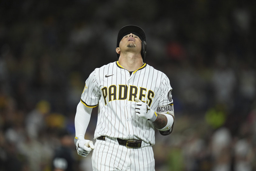 San Diego Padres' Manny Machado reacts after flying out during the fifth inning of a baseball game against the Milwaukee Brewers Monday, Sept. 22, 2025, in San Diego. (AP Photo/Gregory Bull)