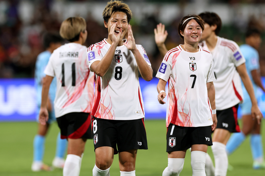 Japan's Kiko Seike, left, celebrates with teammate Hinata Miyazawa after scoring a goal during the Women's Asian Cup soccer match between Japan and India in Perth, Australia, Saturday, March 7, 2026. (Colin Murtyt/AAPImage via AP)