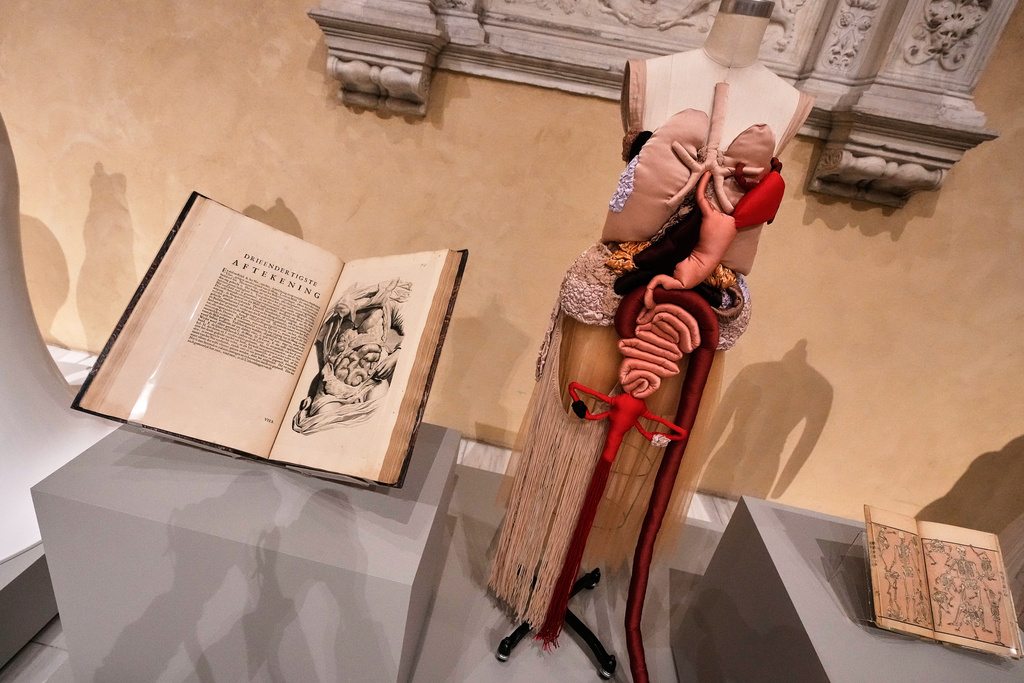 "Corset Anatomia" by Renata Buzzo, right, is displayed during the announcement, at the Metropolitan Museum of Art, in New York, Monday, Nov. 17, 2025, about the next spring fashion exhibit "Costume Art," which is set to launch at the Met Gala in 2026. (AP Photo/Richard Drew)