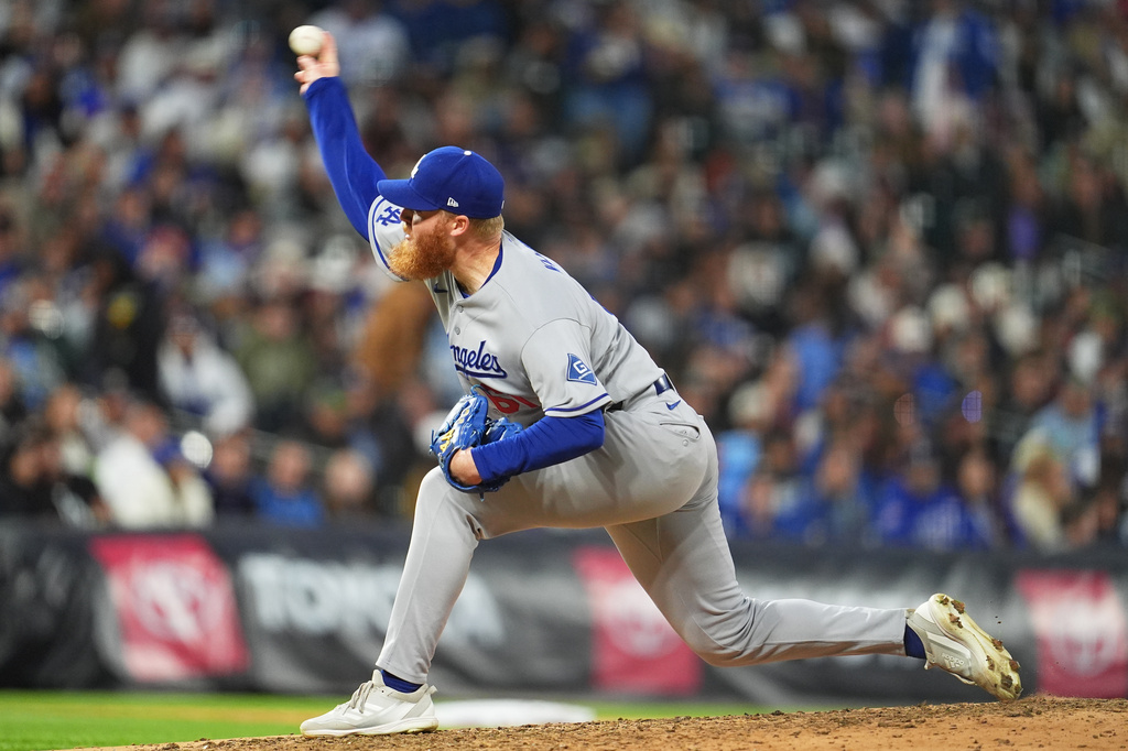 Los Angeles Dodgers relief pitcher Will Klein works against the Colorado Rockies in the sixth inning of a baseball game Saturday, April 18, 2026, in Denver. (AP Photo/David Zalubowski)