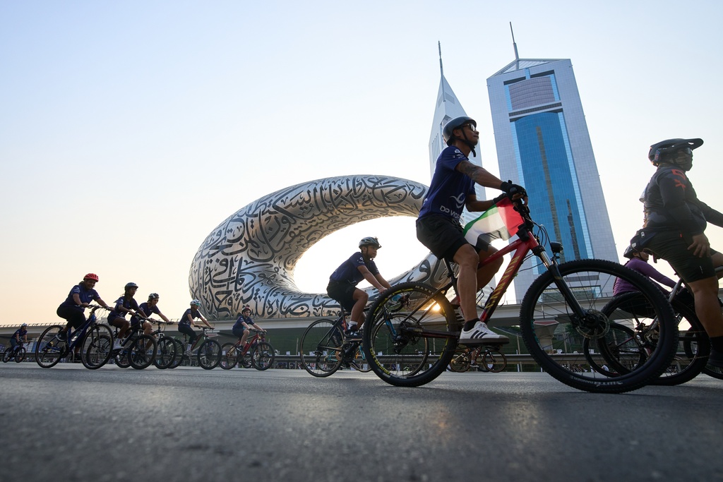 Bicyclists ride along Sheikh Zayed highway during the Dubai Ride annual event in Dubai, United Arab Emirates, Sunday, Nov. 2, 2025. (AP Photo/ Fatima Shbair)