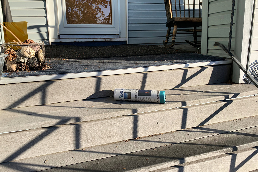 This photo provided by Colleen Elliott shows the Montana Standard laying on her doorstep, Saturday, Oct. 18, 2025, in Butte, Mont. (Colleen Elliott via AP)