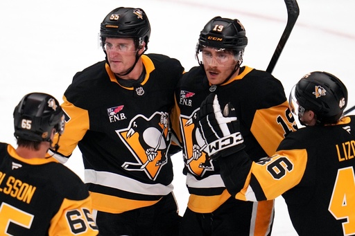 Pittsburgh Penguins' Connor Dewar (19) celebrates his goal during the first period of an NHL hockey game against the Vancouver Canucks in Pittsburgh, Tuesday, Oct. 21, 2025. (AP Photo/Gene J. Puskar) Pittsburgh Penguins' Connor Dewar (19) celebrates his goal during the first period of an NHL hockey game against the Vancouver Canucks in Pittsburgh, Tuesday, Oct. 21, 2025. (AP Photo/Gene J. Puskar)