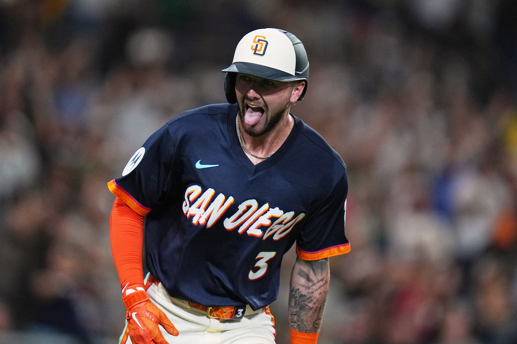 San Diego Padres' Jackson Merrill celebrates after hitting a home run during the eighth inning of a baseball game against the Miami Marlins Friday, Sept. 18, 2026, in San Diego. (AP Photo/Gregory Bull)