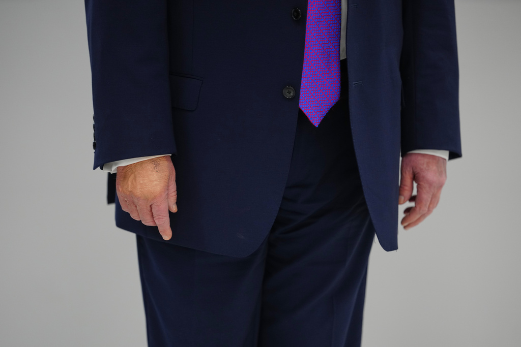 President Donald Trump talks with reporters as he visits Thermo Fisher Scientific, Wednesday, March 11, 2026, in Cincinnati. (AP Photo/Julia Demaree Nikhinson)