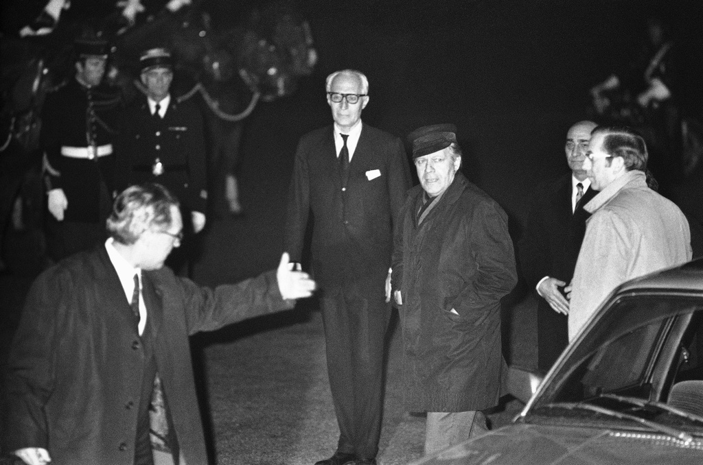 FILE - West German Chancellor Helmut Schmidt is met by French protocol chief Mr. Angles, left, as he arrives at the Chateau de Rambouillet, west of Paris on Nov. 15, 1975 for the Economic and Monetary summit meeting. (AP Photo/Michel Lipchitz, file)