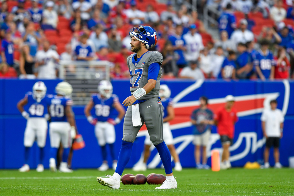 Buffalo Bills quarterback Josh Allen (17) walks on the field during practice at the team's NFL football training camp Saturday, Aug. 8, 2026, in Orchard Park, N.Y. (AP Photo/Adrian Kraus)