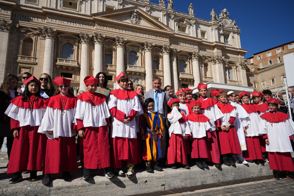 A group of children of Our Lady of Mount Carmel Academy of Chicago pose after attending the Pope Leo XIV weekly general audience in St. Peter's Square, at the Vatican, Wednesday, Oct. 8, 2025. (AP Photo/Andrew Medichini)