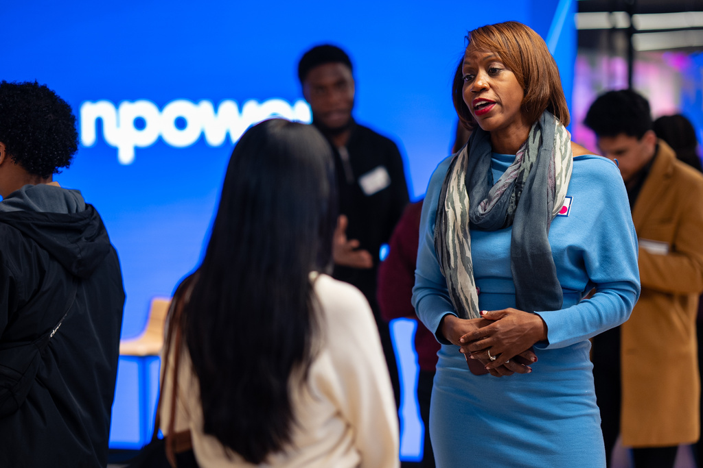 Kendra Parlock, Vice President of Partnership Development at NPower, talks to an NPower alumna during an event at World Wide Technology, Monday, Oct. 20, 2025, in New York. (AP Photo/Angelina Katsanis)