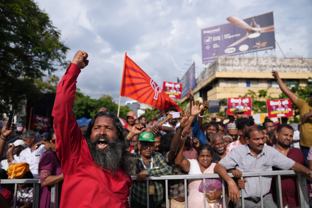 A man shout anti government slogans supporting Sri Lankan lawmaker Namal Rajapaksa, heir to the once-powerful Rajapaksa dynasty, during a public rally in Colombo, Sri Lanka, Friday, Nov. 21, 2025. (AP Photo/Eranga Jayawardena)