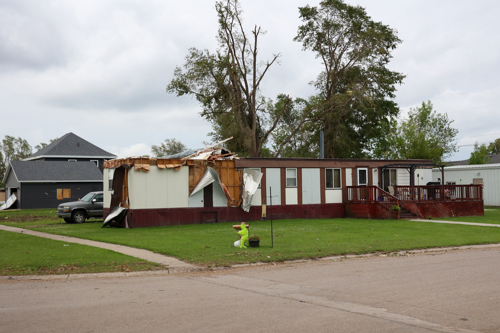 A home's exterior is damaged on June 25, 2025 following an EF5 tornado in Enderlin, N.D. (North Dakota Governor's Office via AP)