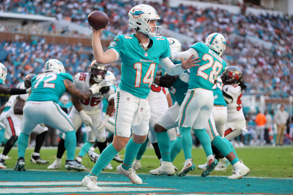 Miami Dolphins quarterback Quinn Ewers (14) looks to pass against the Tampa Bay Buccaneers during the second half of an NFL football game Sunday, Dec. 28, 2025, in Miami Gardens, Fla. (AP Photo/Lynne Sladky)