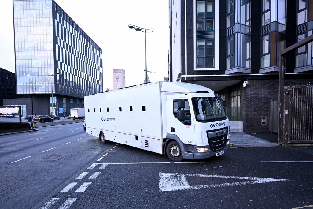 A prison truck arrives at Liverpool Crown Court in Liverpool, England, Tuesday, Dec. 16, 2025. (Peter Powell/PA via AP)