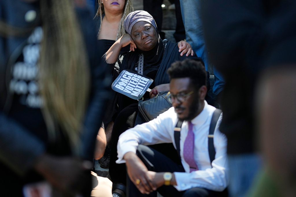 Zulfat Suara listens during a rally after a special session of the state legislature to redraw U.S. Congressional voting maps Thursday, May 7, 2026, in Nashville, Tenn. (AP Photo/George Walker IV)