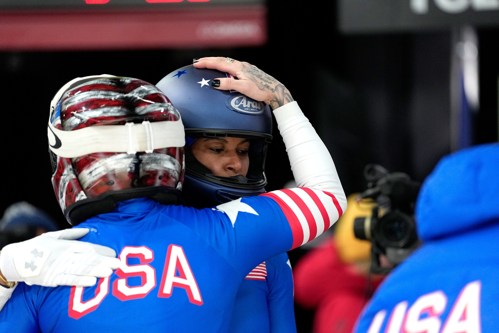 United States' Kaillie Armbruster Humphries, left, and Jasmine Jones, right, arrive at the finish during a two women bobsled run at the 2026 Winter Olympics, in Cortina d'Ampezzo, Italy, Friday, Feb. 20, 2026. (AP Photo/Alessandra Tarantino)
