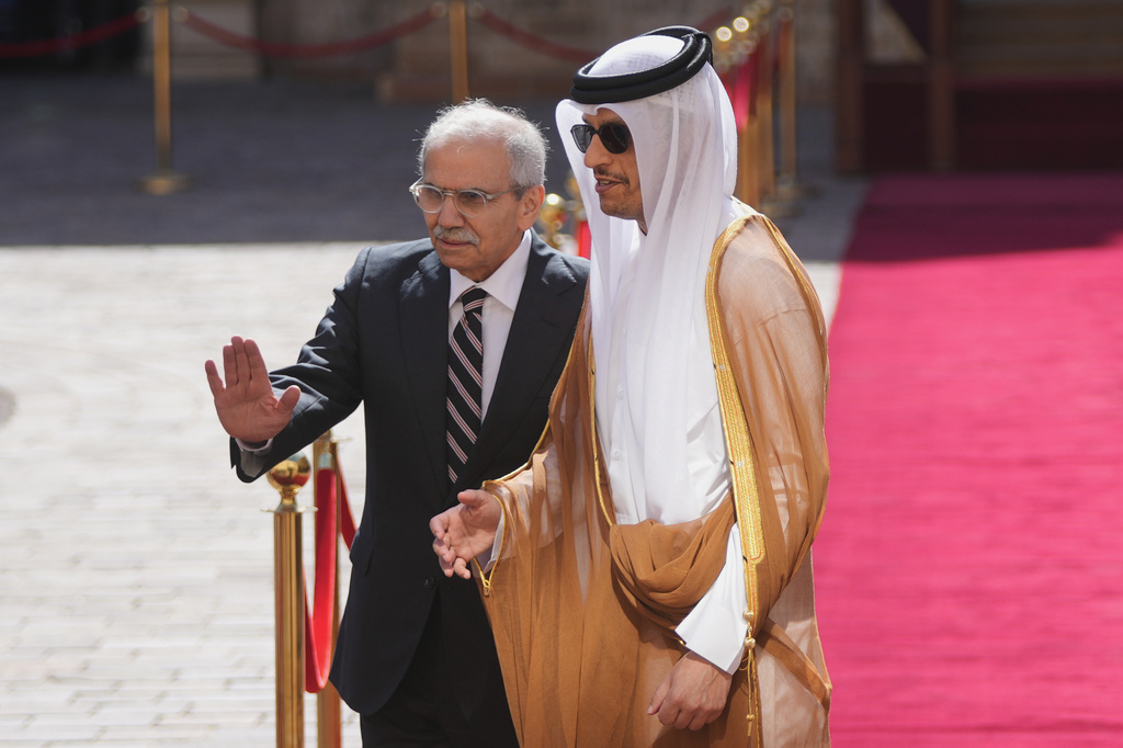 Lebanese Prime Minister Nawaf Salam, left, welcomes Qatar's Prime Minister Mohammed bin Abdulrahman bin Jassim Al Thani after reviewing an honor guard at the Government Palace in Beirut, Lebanon, Friday, Oct. 16, 2026. (AP Photo/Hassan Ammar)