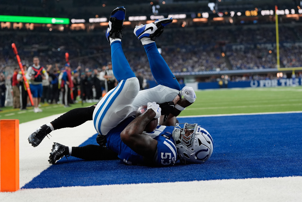 Indianapolis Colts linebacker Germaine Pratt (53) intercepts a pass intended for Jacksonville Jaguars wide receiver Parker Washington during the first half of an NFL football game Sunday, Dec. 28, 2025, in Indianapolis. (AP Photo/Carolyn Kaster)