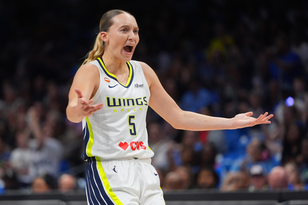 Dallas Wings guard Paige Bueckers questions a call during the first half of a WNBA basketball game against the Phoenix Mercury in Arlington, Texas, Thursday, June 11, 2026. (AP Photo/LM Otero)