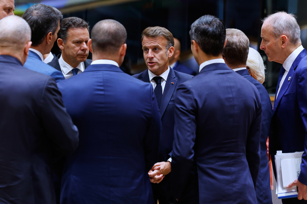 French President Emmanuel Macron, center, talks to other EU leaders during a round table meeting at the EU summit in Brussels, Friday, June 19, 2026. (AP Photo/Geert Vanden Wijngaert)
