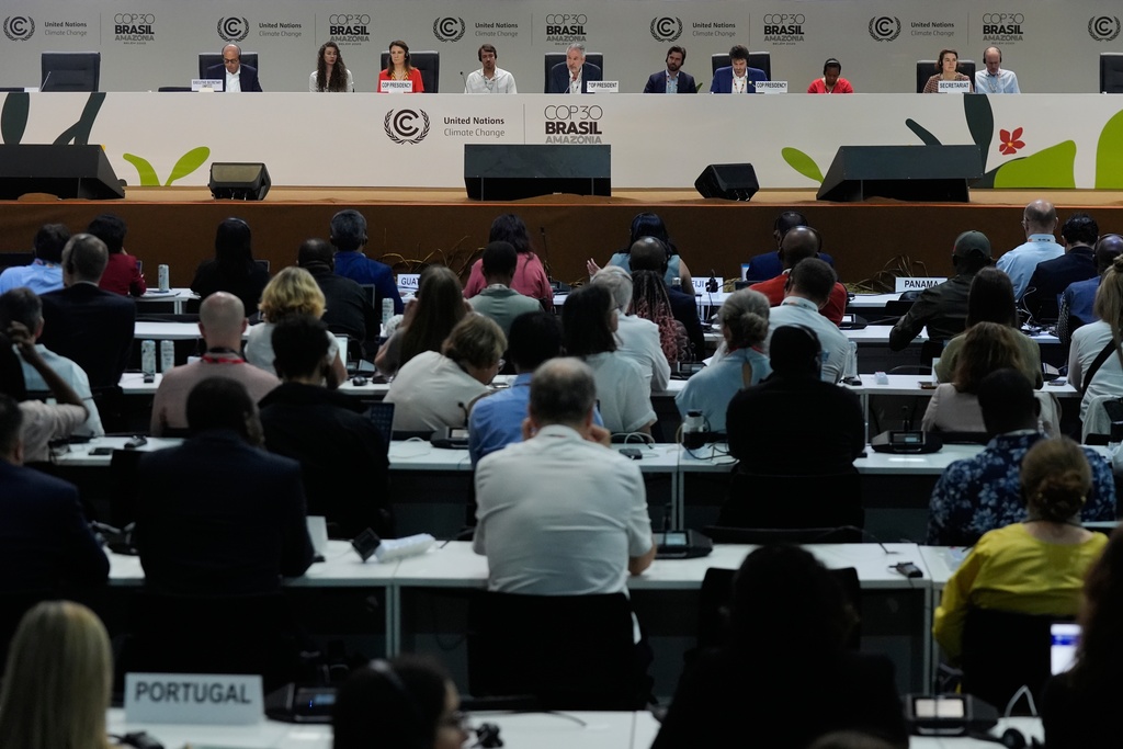 André Corrêa do Lago, COP30 president, center, speaks during a plenary session at the COP30 U.N. Climate Summit, Friday, Nov. 21, 2025, in Belem, Brazil. (AP Photo/Fernando Llano)