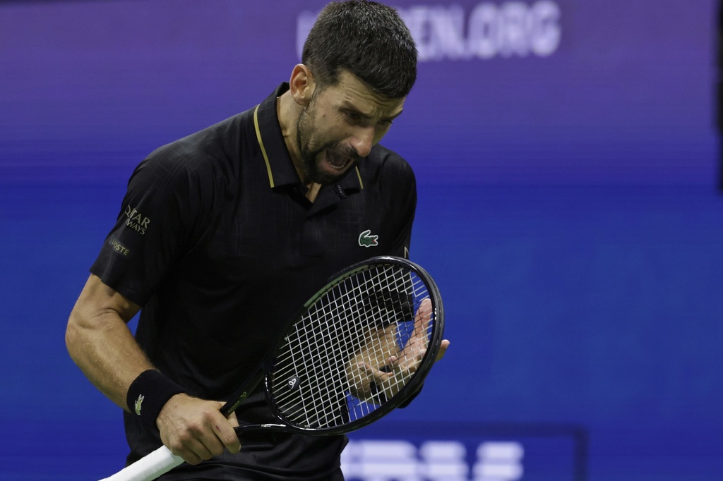 Novak Djokovic, of Serbia, reacts after losing a point against Taylor Fritz, of the United States, during the quarterfinal round of the U.S. Open tennis championships, Tuesday, Sept. 2, 2025, in New York. (AP Photo/Adam Hunger)
