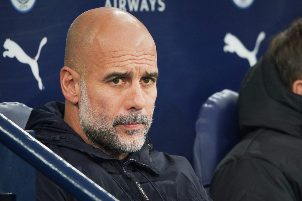 Manchester City's head coach Pep Guardiola waits for the start of the English Premier League soccer match between Manchester City and Bournemouth in Manchester, England, Sunday, Nov. 2, 2025. (AP Photo/Ian Hodgson)