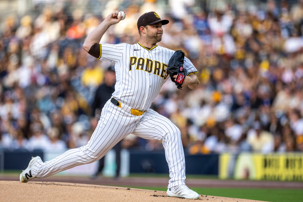San Diego Padres starting pitcher Michael King throws to a Los Angeles Dodgers batter in the first inning of a baseball game, Monday, May 18, 2026, in San Diego. (AP Photo/Tony Ding)