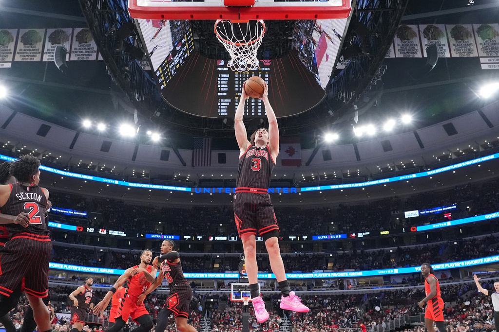 Chicago Bulls guard Josh Giddey (3) grabs a rebound against the Portland Trail Blazers during the first quarter in an NBA basketball game Thursday, Feb. 26, 2026, in Chicago. (AP Photo/David Banks)