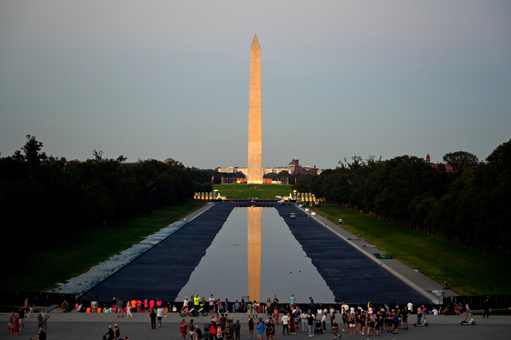 The Washington Monument reflects in the evening light in the newly renovated Lincoln Memorial Reflecting Pool that is in the process of refilling, Friday, June 5, 2026, in Washington. (AP Photo/John McDonnell