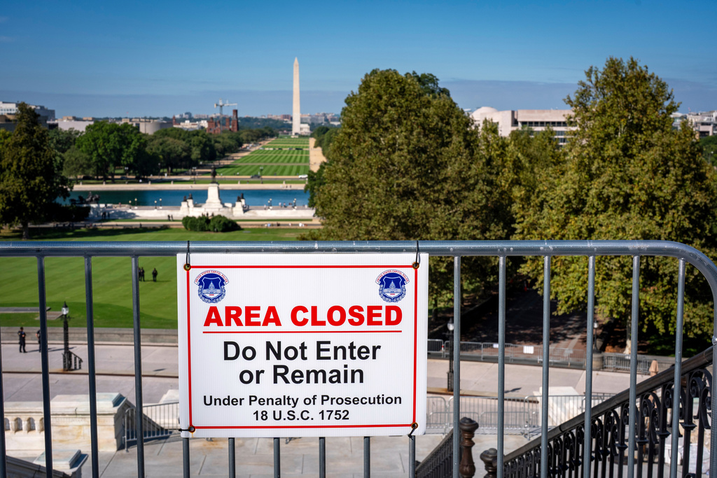 The West Lawn of the Capitol and the National Mall stretch into the distance as seen from the terrace of the Capitol on the first day of a government shutdown, Capitol in Washington, Wednesday, Oct. 1, 2025. (AP Photo/J. Scott Applewhite)