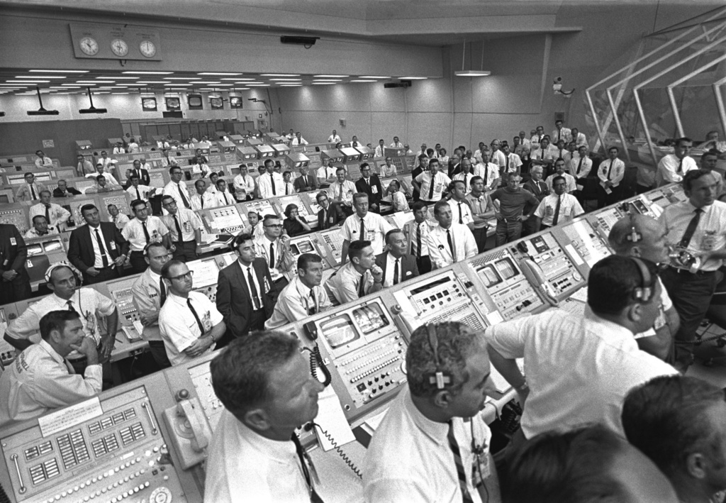 FILE - In this photo provided by NASA, JoAnn Morgan, sitting in the center of the third row, watches the launch of Apollo 11 from the launch firing room, July 16, 1969, in Cape Canaveral, Fla. (NASA via AP, File)