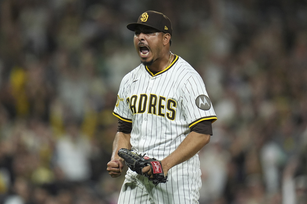 San Diego Padres relief pitcher Jeremiah Estrada celebrates after the third out during the eighth inning of a baseball game against the Milwaukee Brewers Monday, Sept. 22, 2025, in San Diego. (AP Photo/Gregory Bull)