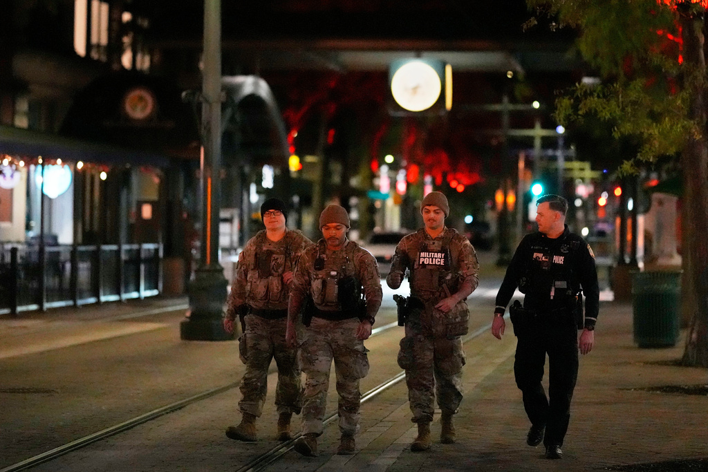 Members of the National Guard patrol along Main Street, Friday, Oct. 24, 2025, in Memphis, Tenn. (AP Photo/George Walker IV)