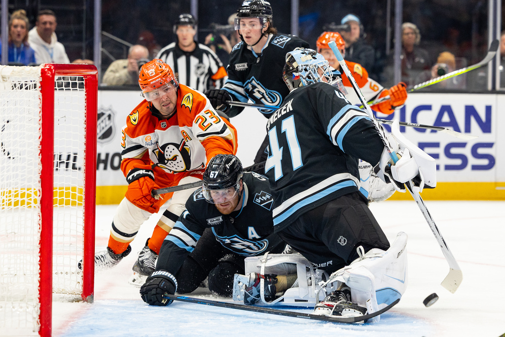 Utah Mammoth left wing Lawson Crouse (67) saves the puck during the second period of an NHL hockey game against the Anaheim Ducks, Friday, March 20, 2026, in Salt Lake City. (AP Photo/Melissa Majchrzak)