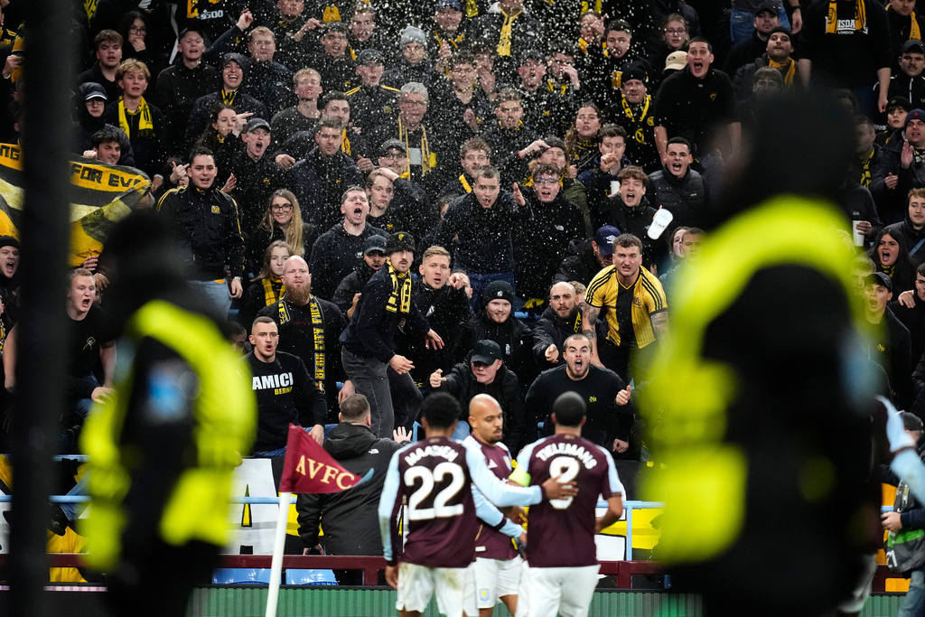 Young Boys' fans react as Aston Villa's Donyell Malen, center, celebrates after scoring the opening goal during the Europa League soccer match between Aston Villa and Young Boys in Birmingham, England, Thursday, Nov. 27, 2025. (Nick Potts/PA via AP)