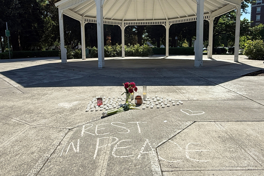 A vigil for those killed in a paper mill chemical tank rupture in Longview, Wash. is seen on May 27, 2026. (AP Photo/Claire Rush)