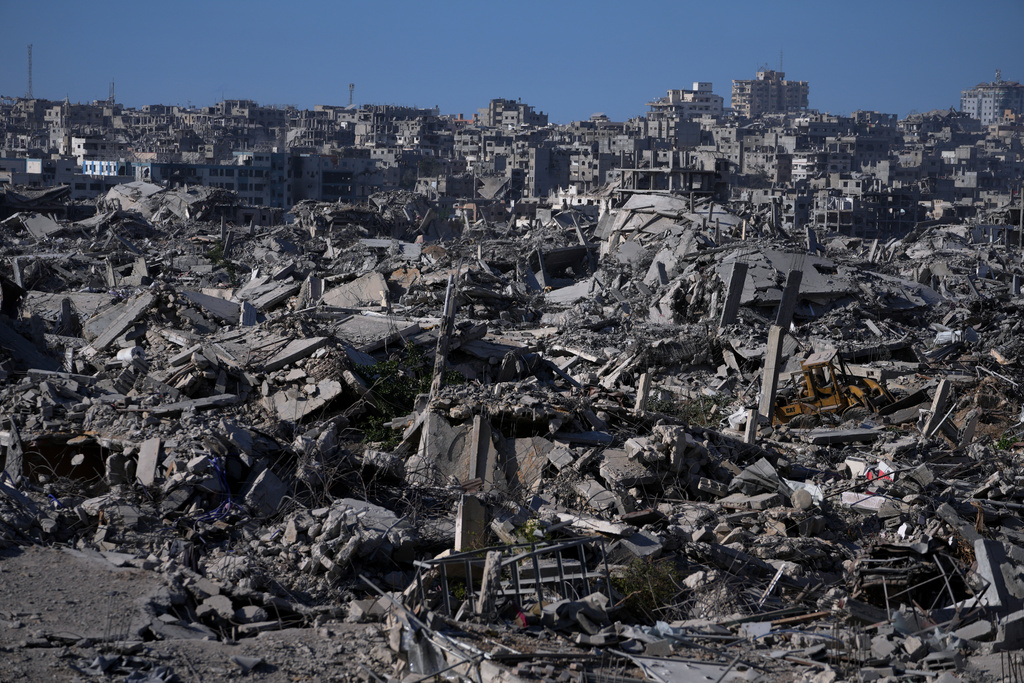 Destroyed buildings and rubble are seen in the Zeitoun neighborhood of Gaza City, Friday, Oct. 10, 2025, after Israel and Hamas agreed to pause their war and release the remaining hostages. (AP Photo/Jehad Alshrafi)