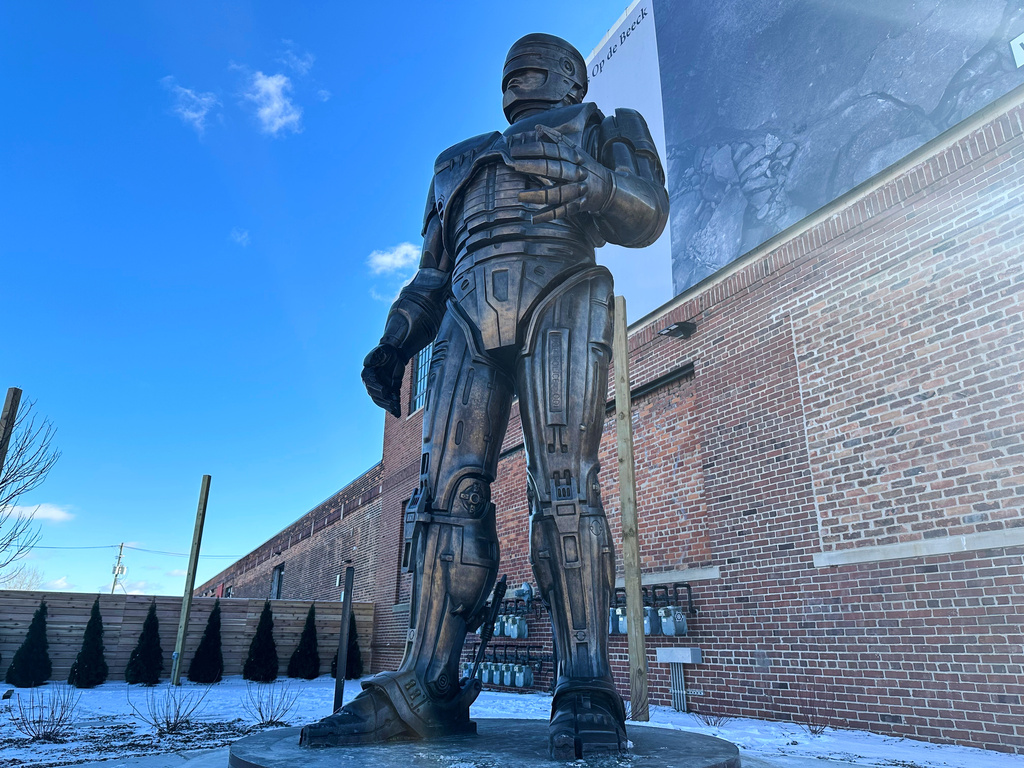 A statue of RoboCop stands outside a business in Detroit's Eastern Market area, Thursday, Dec. 4, 2025. (AP Photo/Mike Householder)