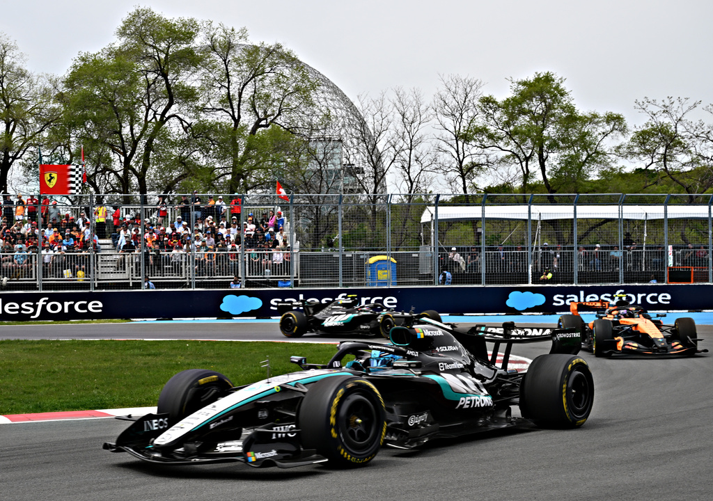 Mercedes driver George Russell, of Britain, followed by McLaren driver Lando Norris, right, of Britain and Mercedes driver Kimi Antonelli, of Italy, navigates a turn during the sprint race at the F1 Canadian Grand Prix auto race in Montreal, Saturday, May 23, 2026. (Jacques Boissinot/The Canadian Press via AP)