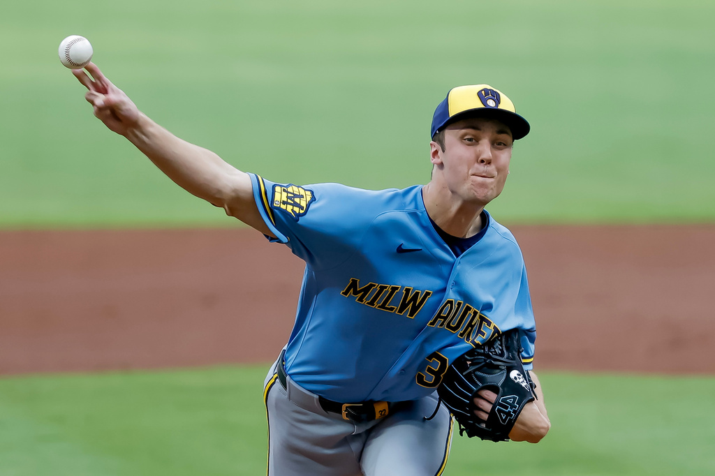 Milwaukee Brewers pitcher Jacob Misiorowski, right, delivers a pitch to Atlanta Braves' Matt Olson during the first inning of a baseball game, Friday, June 19, 2026, in Atlanta. (AP Photo/Erik S. Lesser)