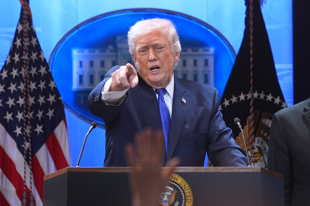 President Donald Trump points to a reporter during a press briefing at the White House, Friday, Feb. 20, 2026, in Washington. (AP Photo/Evan Vucci)