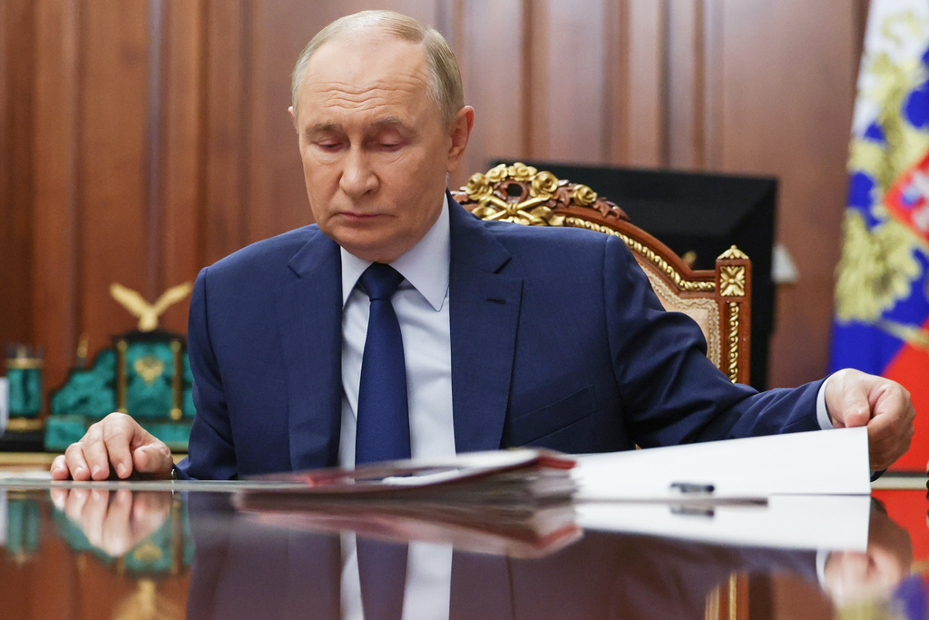 Russian President Vladimir Putin attends a meeting with Russian Deputy Prime Minister Dmitri Patrushev at the Kremlin in Moscow, Russia, Monday, Oct. 6, 2025. (Alexander Kazakov, Sputnik, Kremlin Pool Photo via AP)