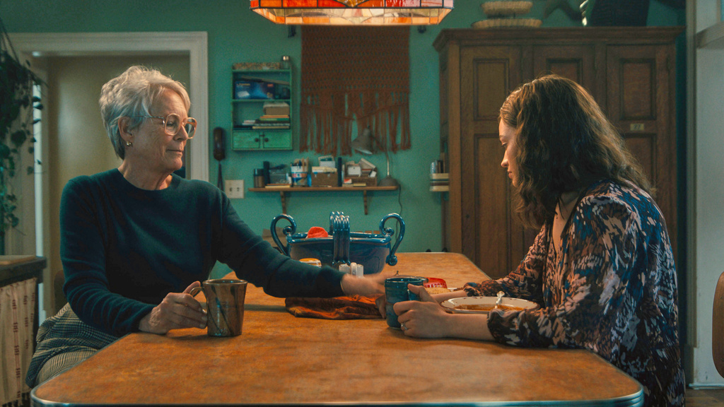 This image released by 20th Century Studios shows Jamie Lee Curtis, left, and Emma Mackey in a scene from "Ella McCay." (20th Century Studios via AP)