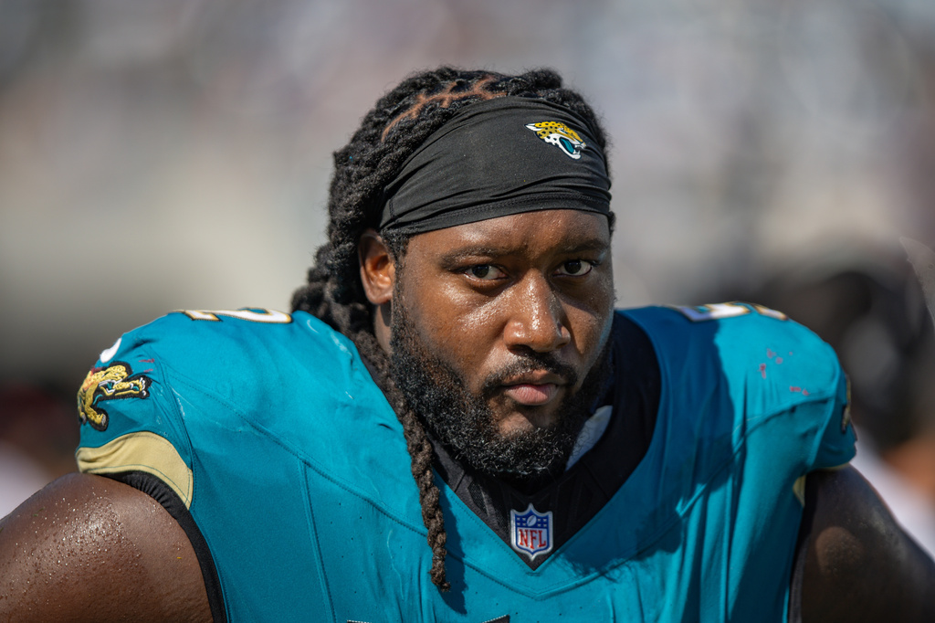FILE - Jacksonville Jaguars defensive tackle Davon Hamilton (52) walks the sideline during an NFL football game against the New England Patriots in Jacksonville, Fla., Sept. 27, 2026. (AP Photo/Gary McCullough, File)