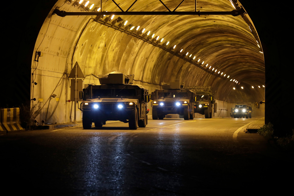 Taiwan Army armored vehicles drive through a tunnel during an overnight cross-region deployment from Hualien to reinforce Yilan during the annual Han Kuang military exercises in Hualien, eastern Taiwan, late Sunday night, Aug. 9, 2026. (AP Photo/Chiang Ying-ying, Pool)