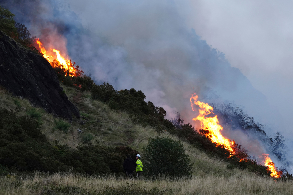 A view of a fire on Arthur's Seat in Holyrood Park, in Edinburgh, Scotland, Sunday, Aug. 10, 2025. (Jane Barlow/PA via AP)